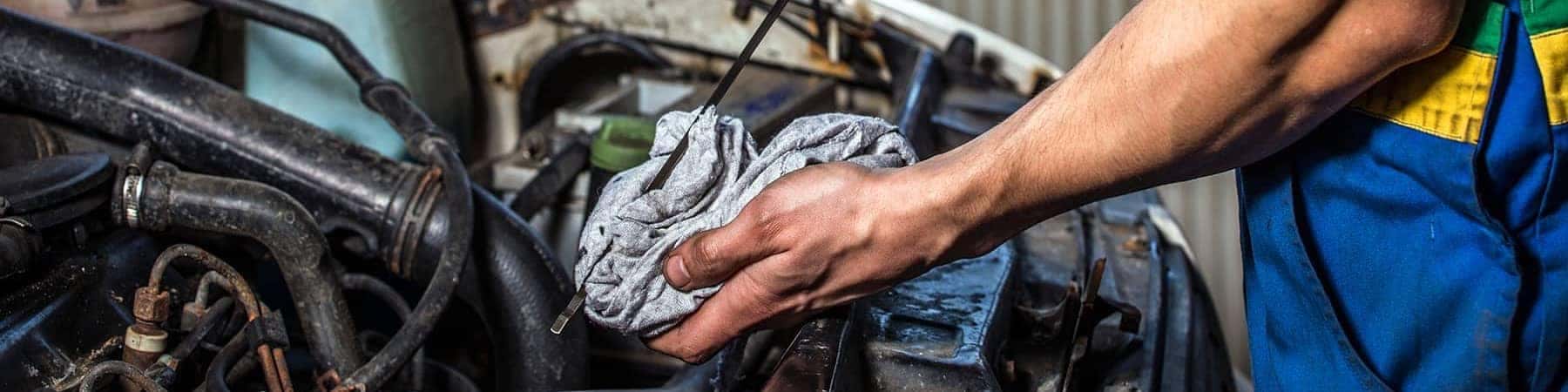 Mechanic Checking Oil with Rag
