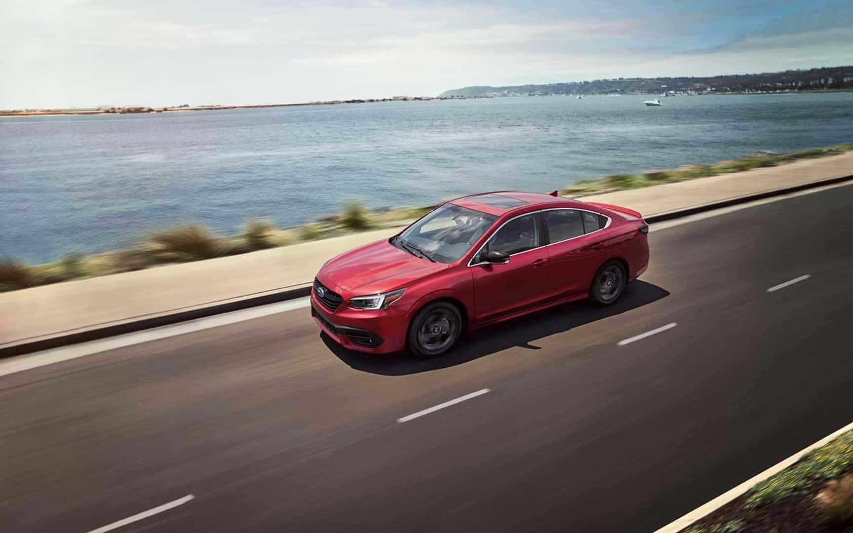 Subaru vehicle driving on the road