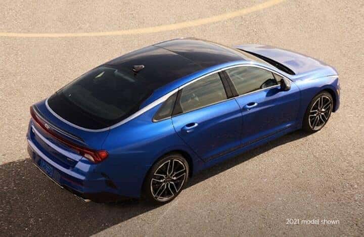 Blue 2022 Kia K5 on road
