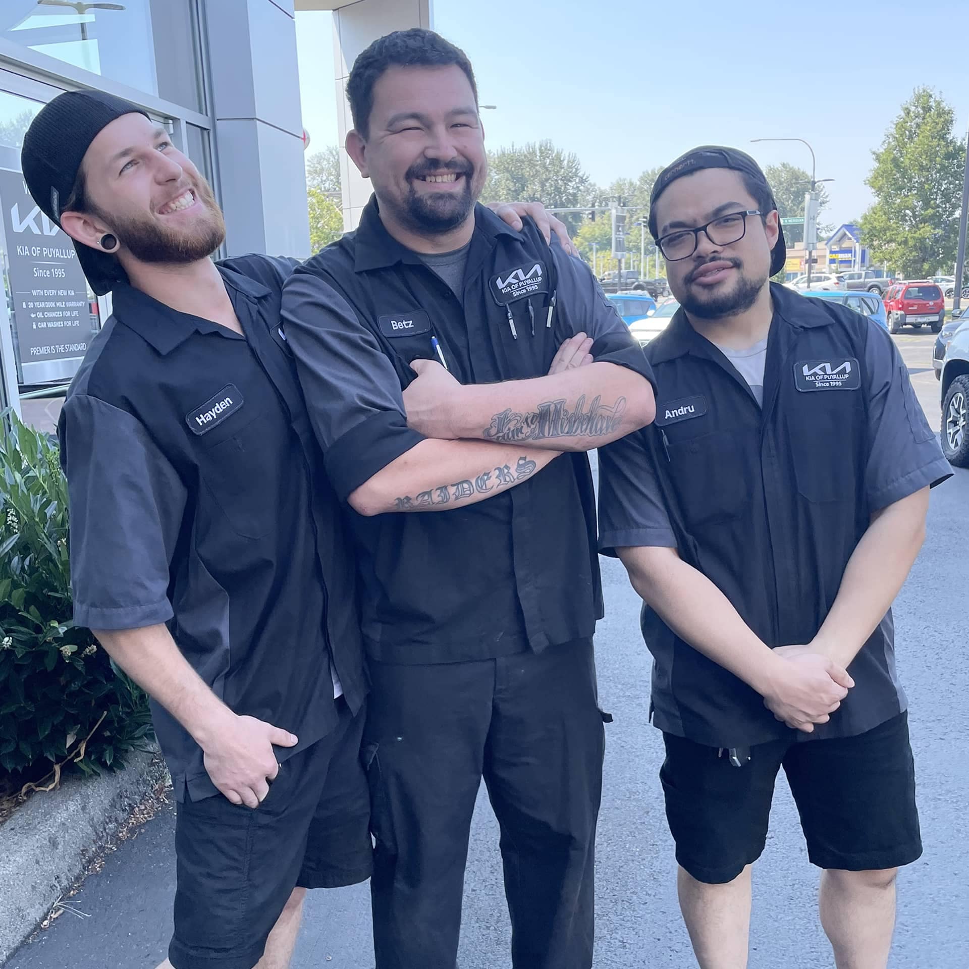 Three staff members standing together
