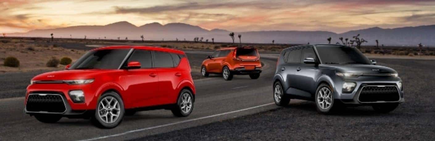 Three_2022_Kia_Soul_vehicles_on_a_road_o