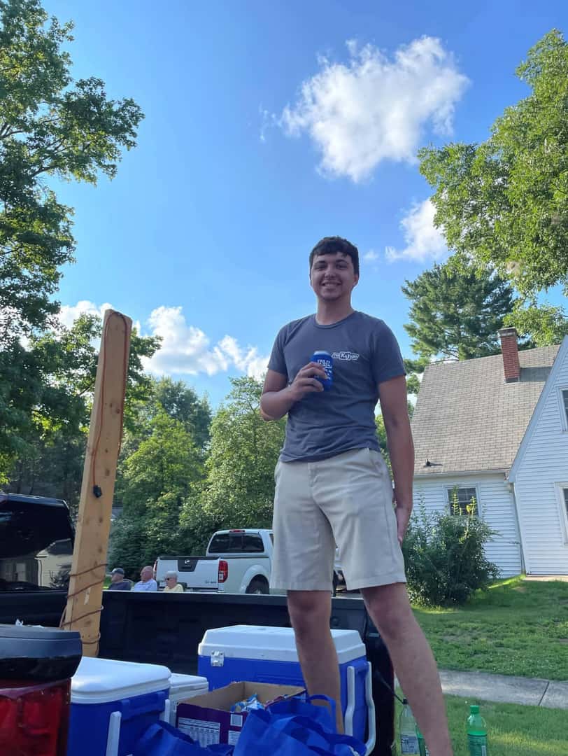 person-on-truck-gate-smiling