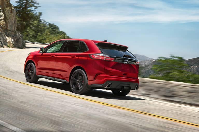 Red 2022 Ford Edge on a curving road_mobile