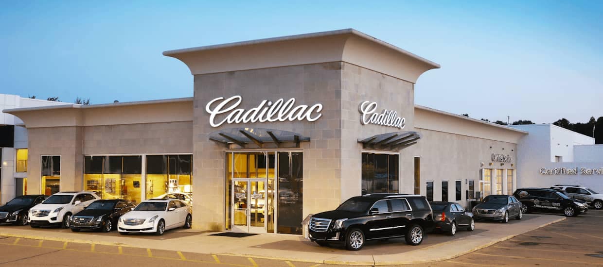 An exterior shot of the LaFontaine Cadillac dealership at dusk.