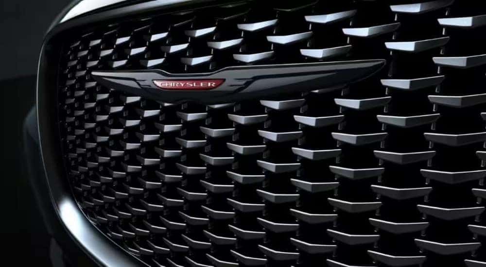 A close up shows the black grille on a 2023 Chrysler 300S.