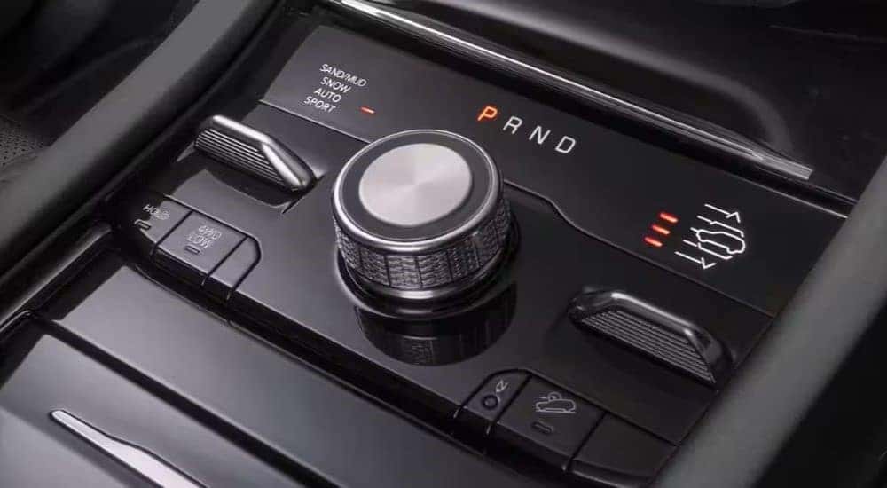 The gear selector knob is shown in a 2024 Jeep Grand Cherokee.