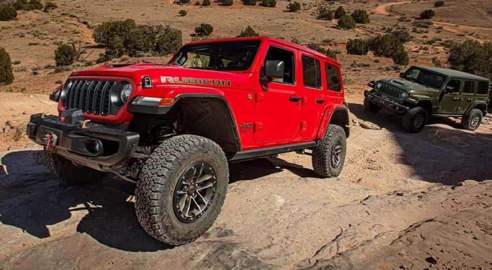 A red 2024 Jeep Wrangler 392 is shown after leaving a Jeep Wrangler dealer.