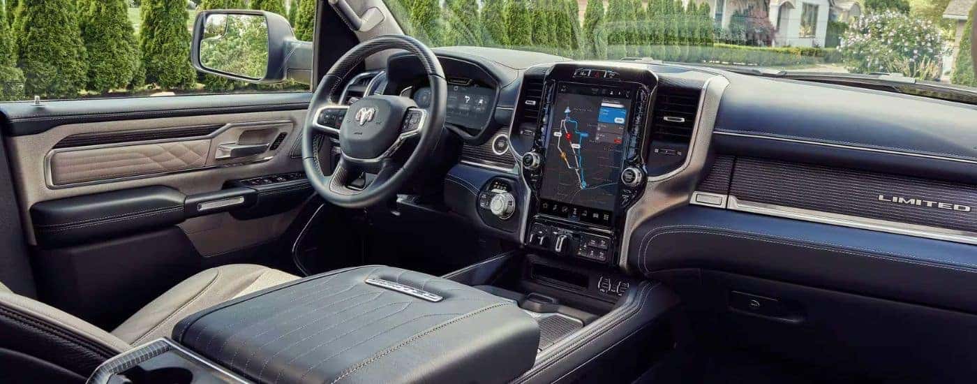 The tan interior of a 2024 Ram 1500 Limited is shown from the passenger seat.