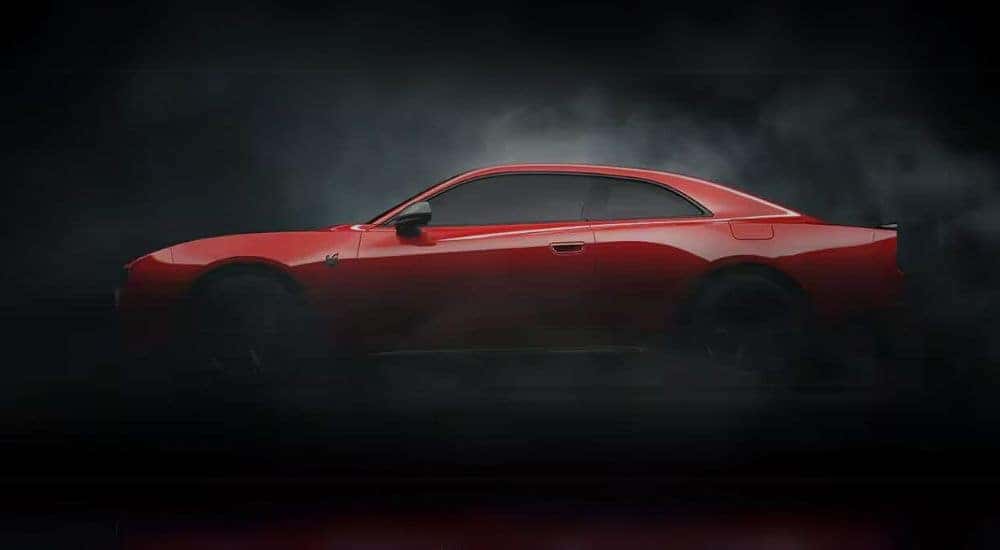 A red 2025 Dodge Charger Daytona Scat Pack is shown after looking at Dodge Charger sales.