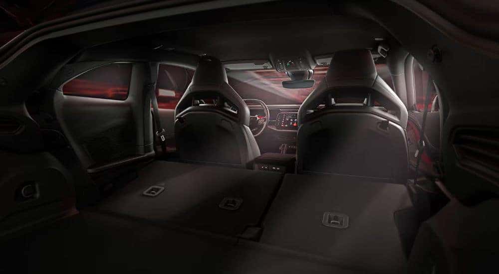 The black interior is shown in a 2025 Dodge Charger.