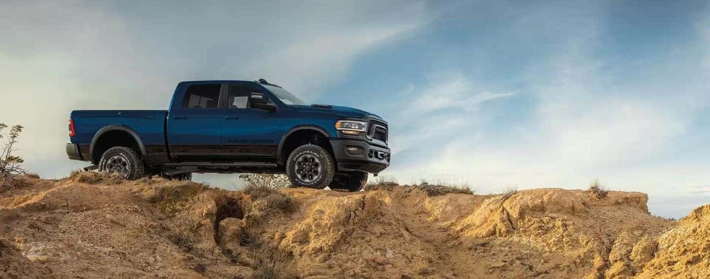 A blue 2024 Ram 2500 Power Wagon is shown from the side.