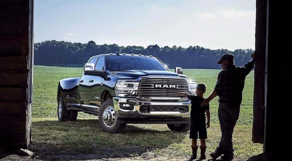 A person is shown pointing at a 2024 Ram 3500 for sale.
