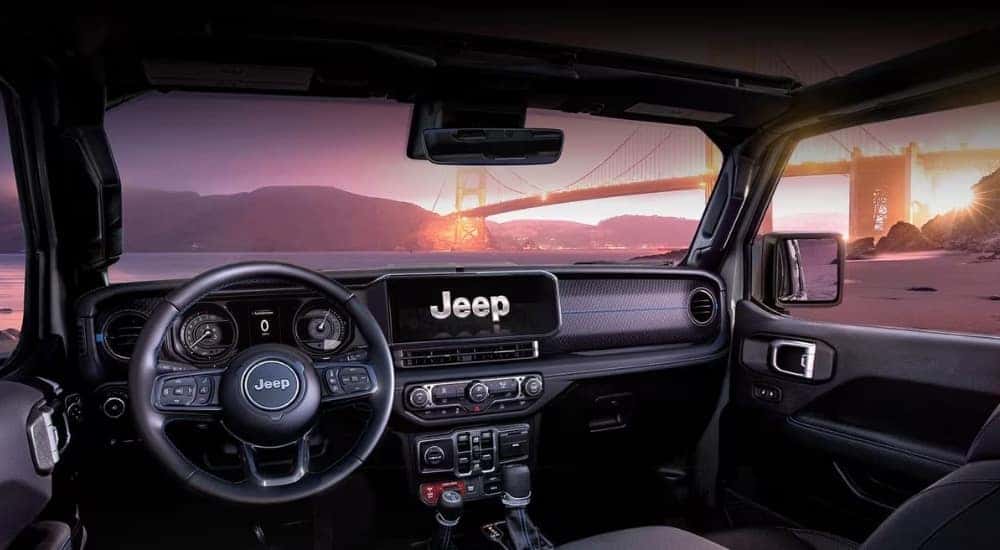 The black dash and infotainment screen in a  2024 Jeep Wrangler.