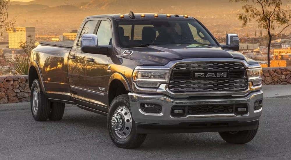 A grey 2023 Ram 3500 is shown parked on pavement.