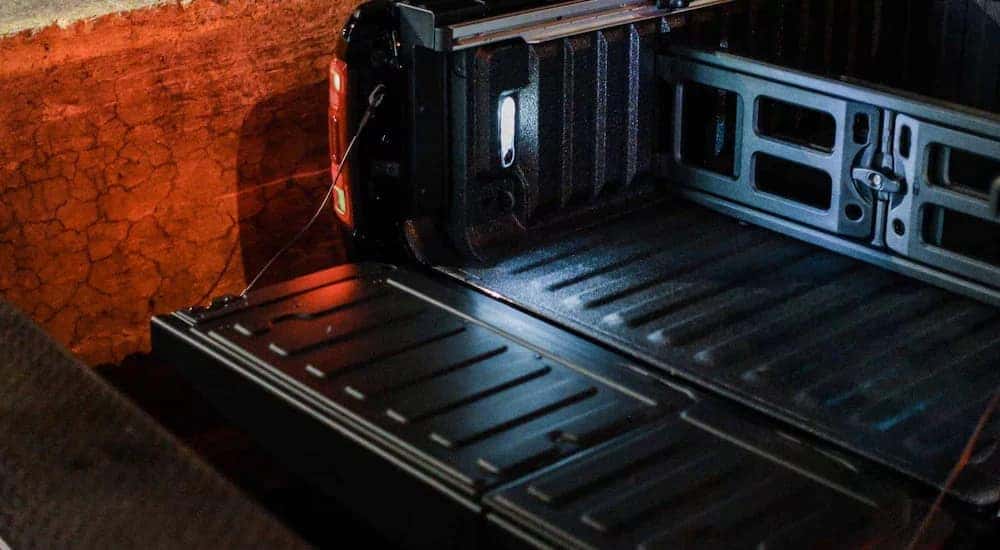 A close-up of a tailgate is shown on a 2024 Ram 1500.