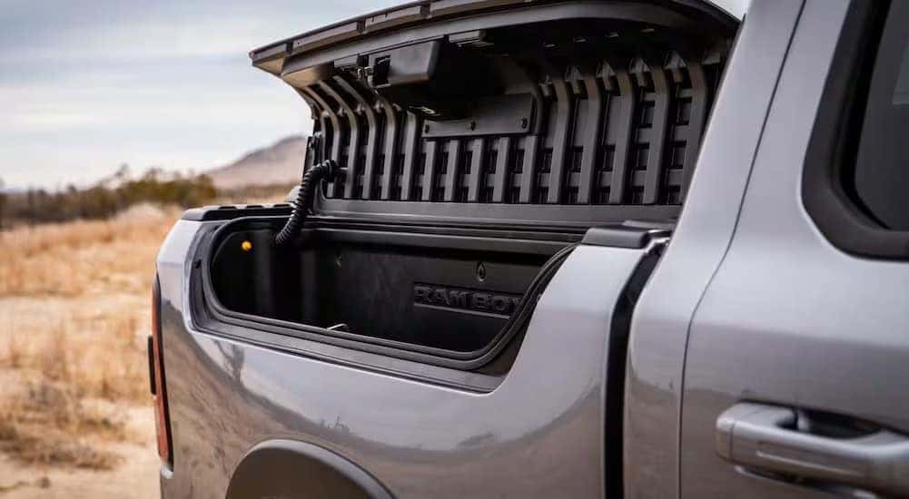A close-up of a Rambox is shown on a silver 2024 Ram 1500.