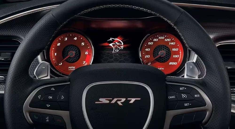 A close-up of the digital dash display is shown in a 2023 Dodge Charger SRT.