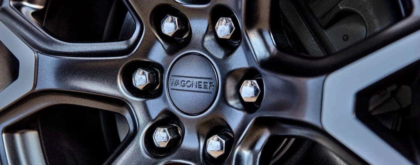 A close up shows a silver rim on a 2023 Jeep Wagoneer.