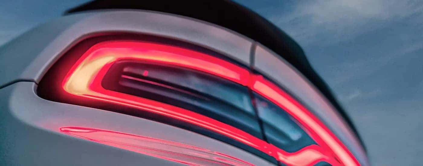 A close up of the brake light on a white 2023 Dodge Charger.