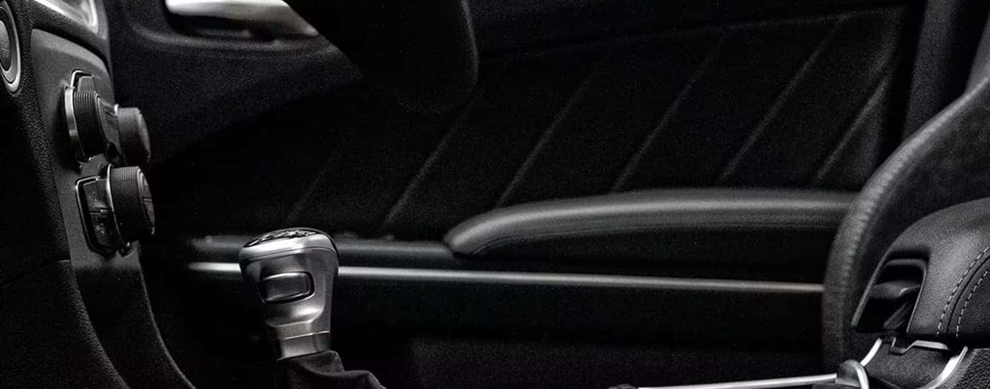 The black interior of a 2023 Dodge Charger shows the center console.