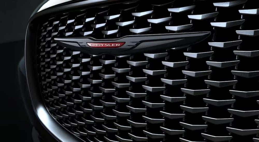 Close-up of the black grille on a 2023 Chrysler 300S at a Chrysler dealer near Charlotte.