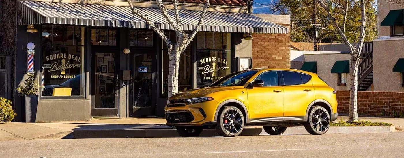 A yellow 2024 Dodge Hornet GT is shown from the side.