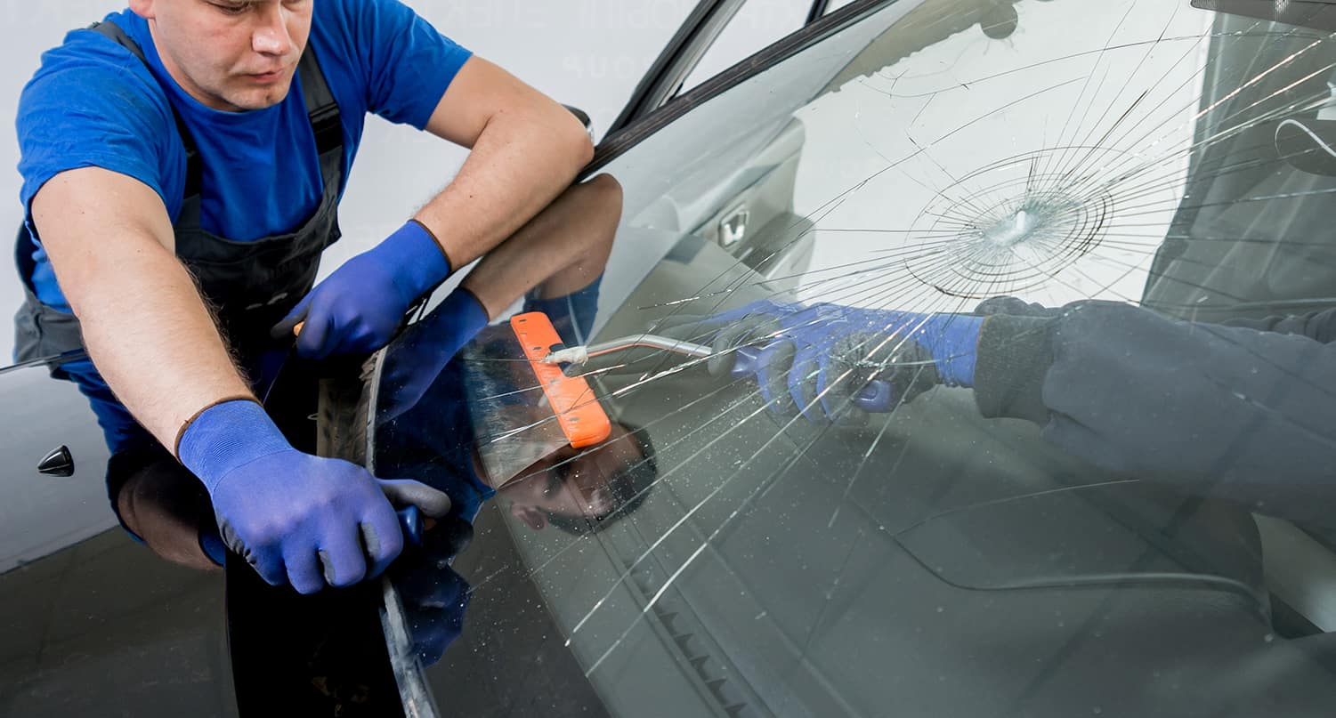 service technician replacing a windshield