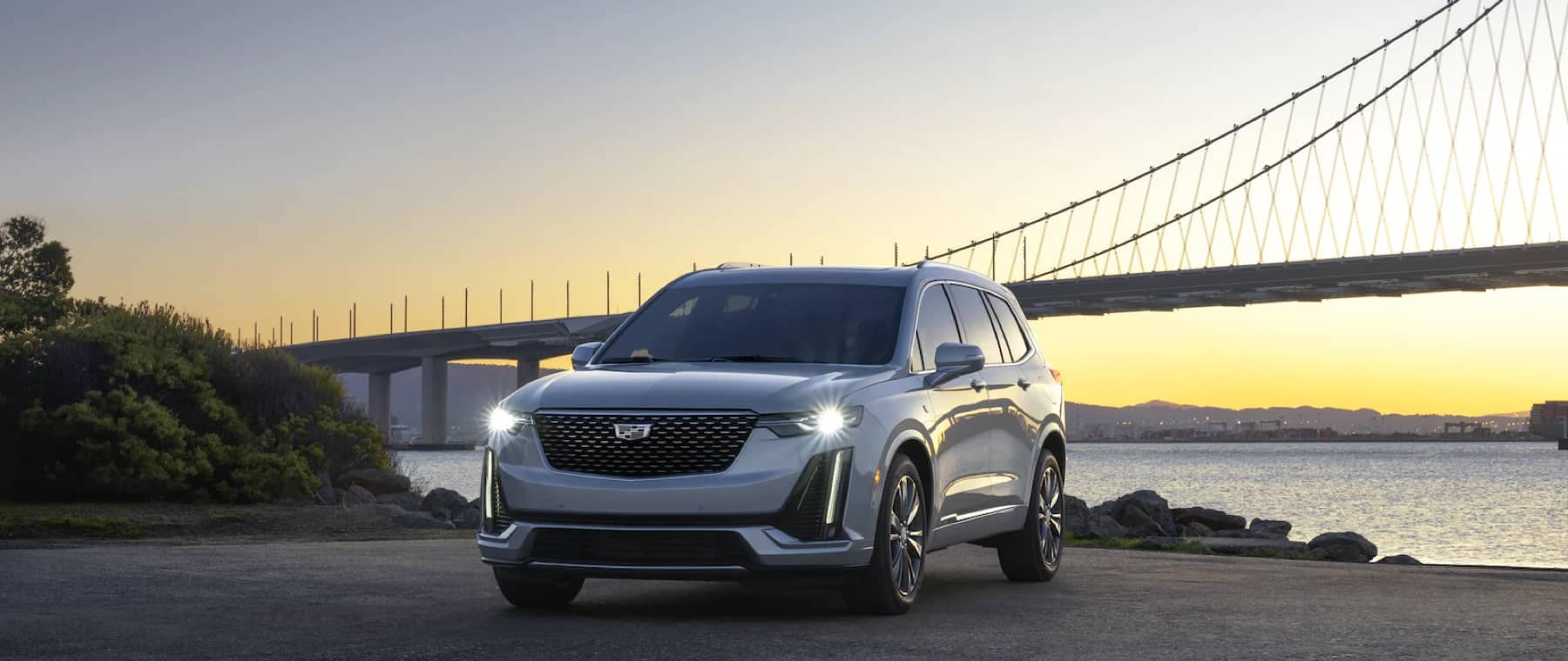 2021 Cadillac XT6 Parked at dusk with a bridge in the background
