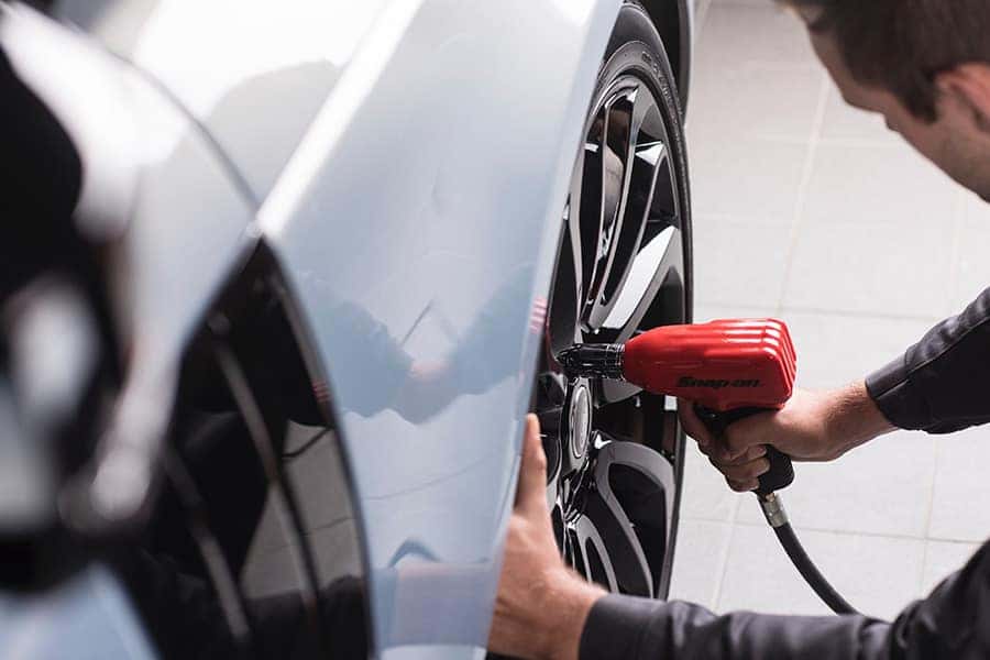 Land Rover Mechanic tightens a lug nut