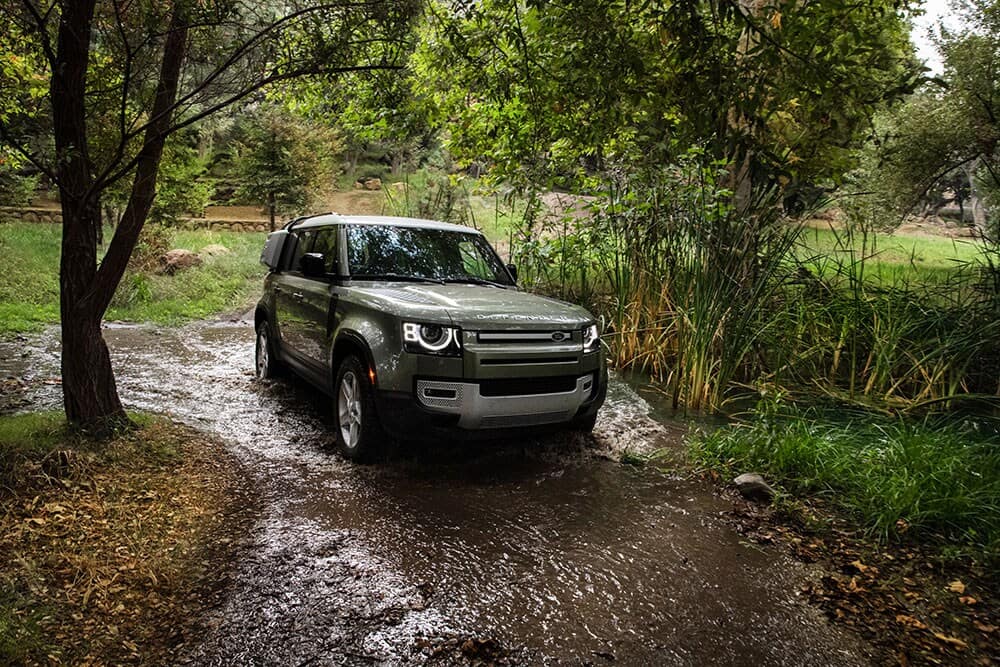 Land Rover driving through wet terrain