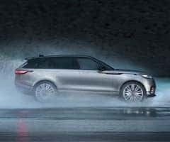 Land Rover driving through the rain