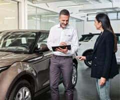 Land Rover Client Advisor talks with a customer