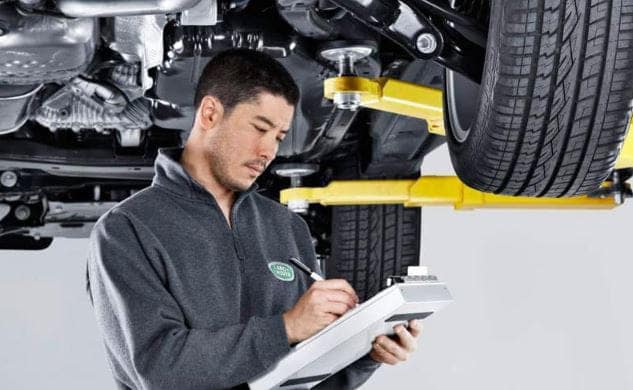 Land Rover Technician taking notes