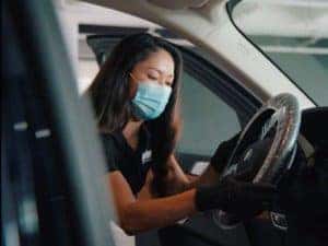 employee-wiping-steering-wheel
