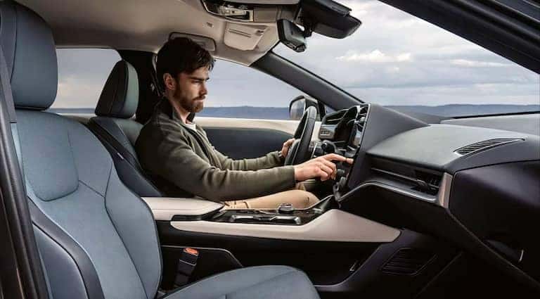 2024-Lexus-RZ-450E-interior-with-person-driving