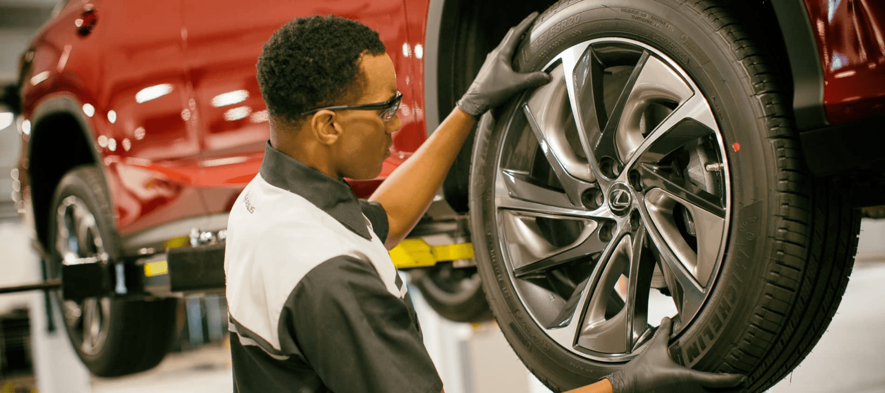 Lexus technician replacing tire