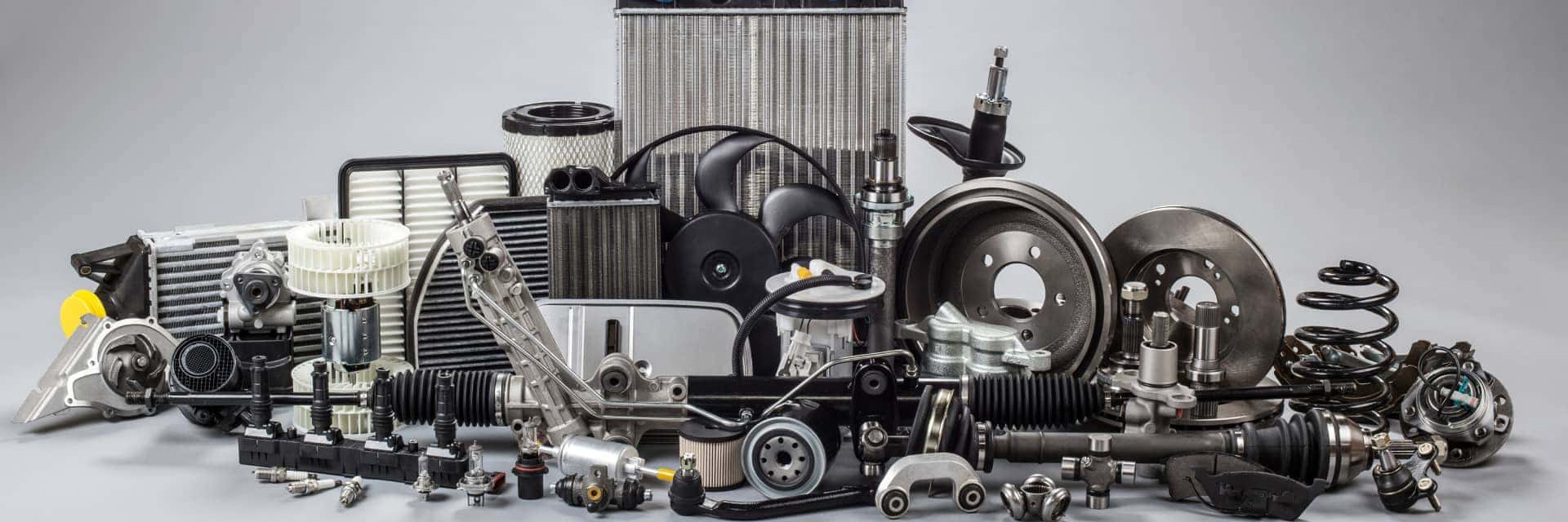 Various Car Parts on Grey Background