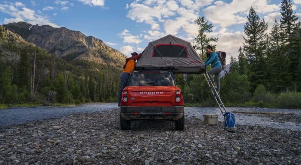 An orange 2023 Ford Bronco Sport is shown from the rear after leaving a Ford SUV dealer.