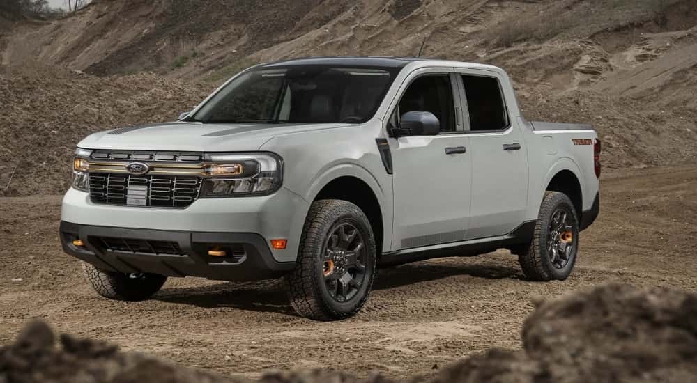 A grey 2023 Ford Maverick Tremor is shown parked off-road.