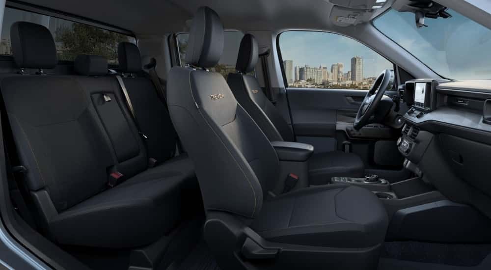 The black leather interior is shown in a 2023 Ford Maverick XLT Tremor.
