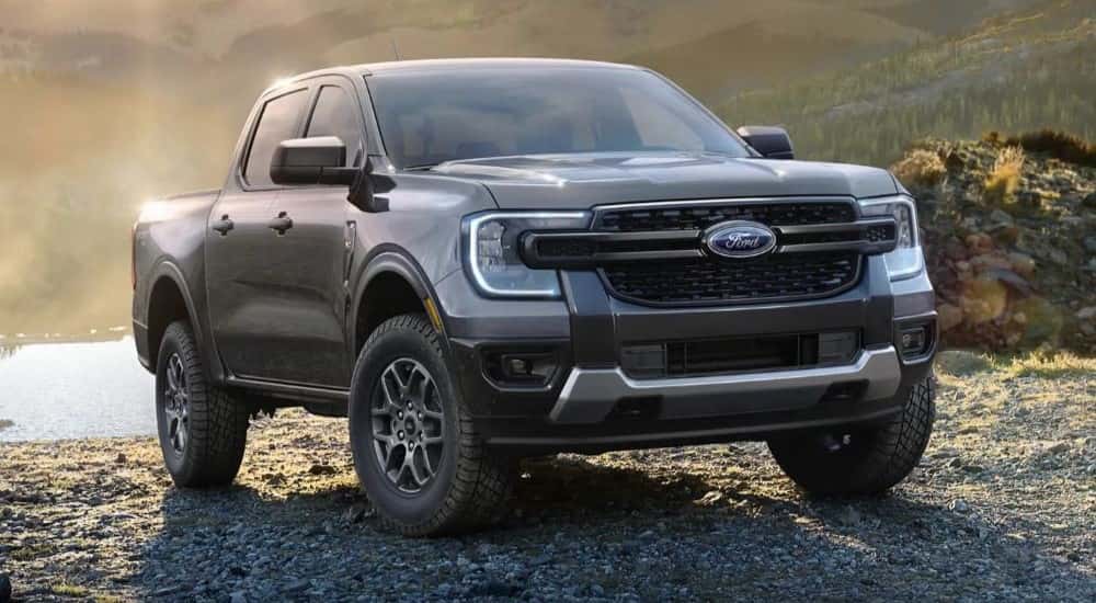 A grey 2024 Ford Ranger is shown parked near a lake after leaving a Snellville Ford dealer.