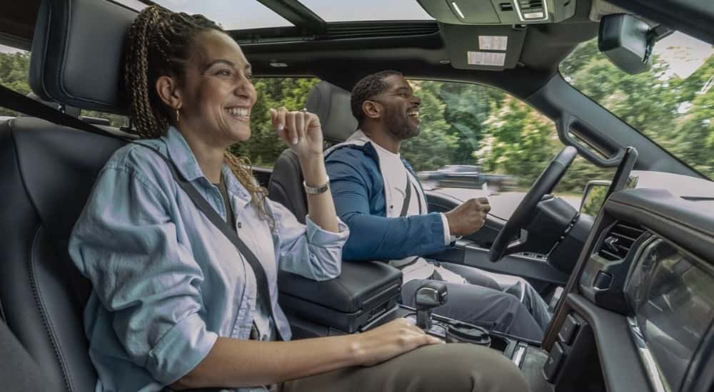 A person is shown using the BlueCruise feature in a 2024 Ford F-150 Lightning.