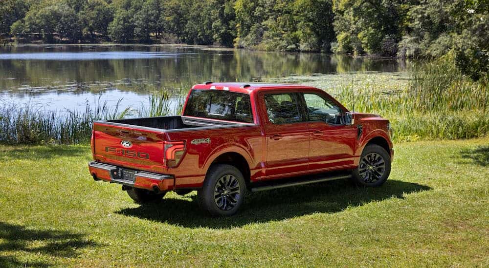 a red 2025 Ford F-150 is shown from the rear at an angle.