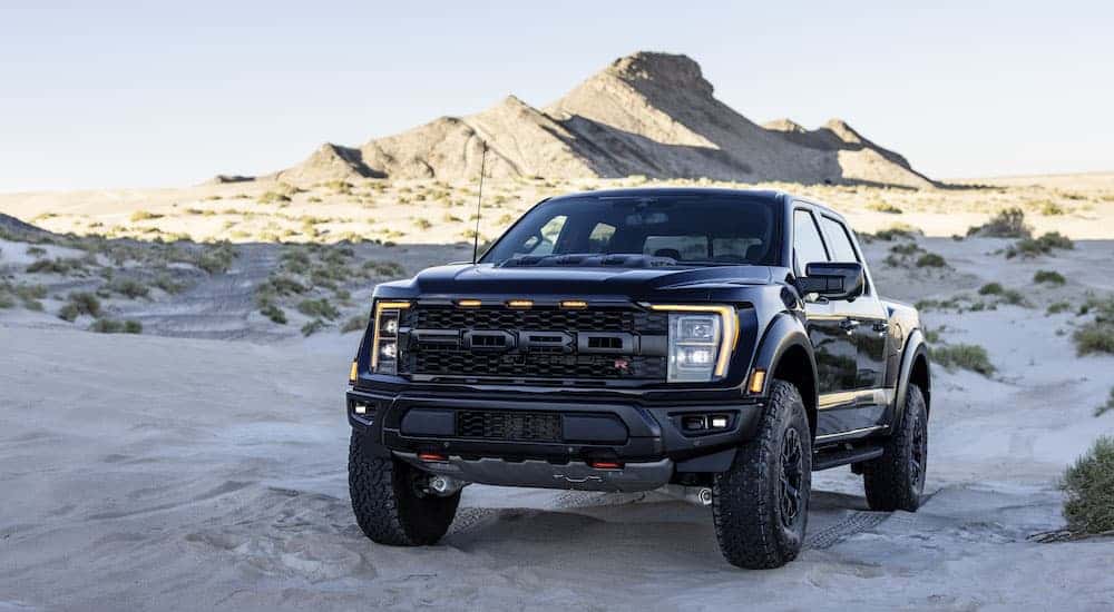 A black 2025 Ford Raptor R is shown from the front at an angle.