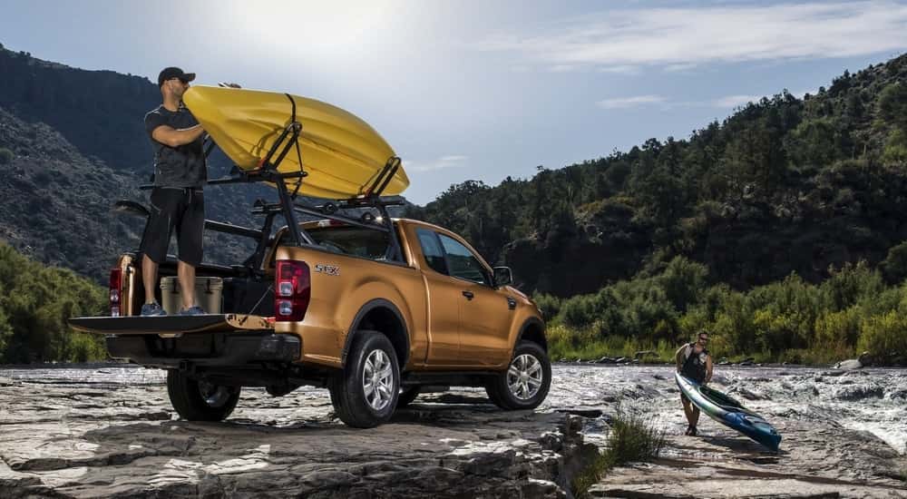 A bronze 2019 Ford Ranger STX is shown near a river.