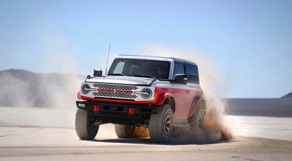 A red 2025 Ford Bronco Stroppe Edition is shown from the front at an angle.