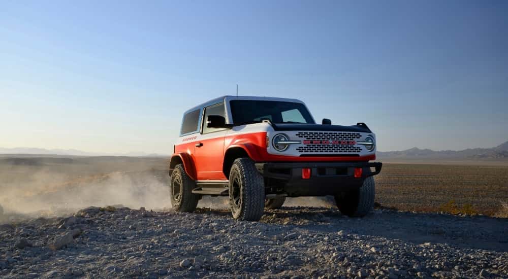 A red 2025 Ford Bronco Stroppe Edition is shown from the front at an angle.