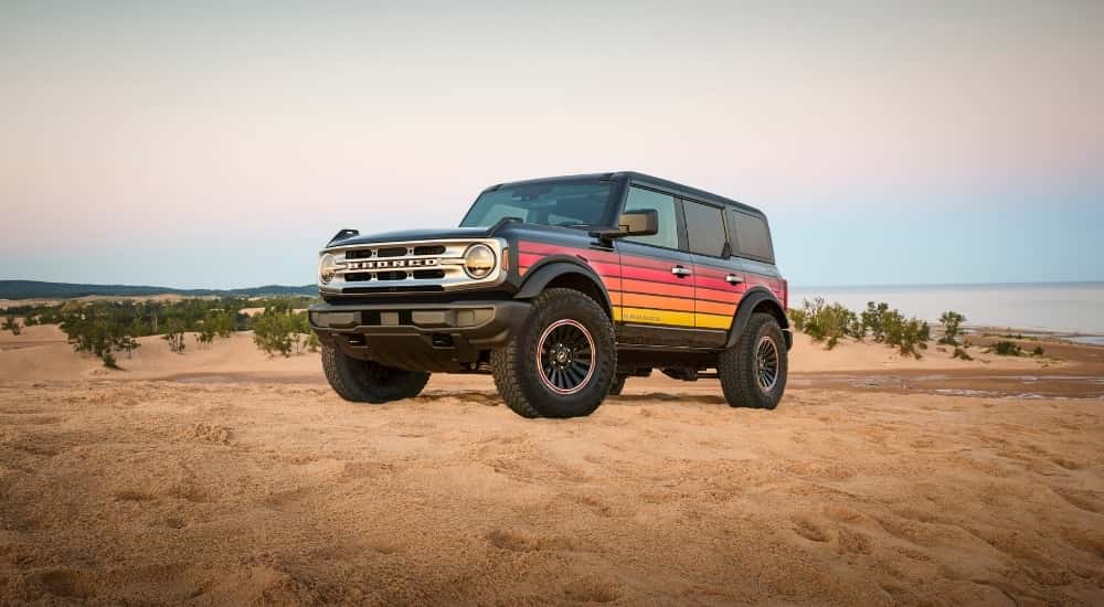 A grey 2025 Ford Bronco Free Wheeling is shown from the front at an angle.