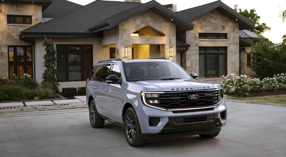 A grey 2025 Ford Expedition is shown parked on a driveway.
