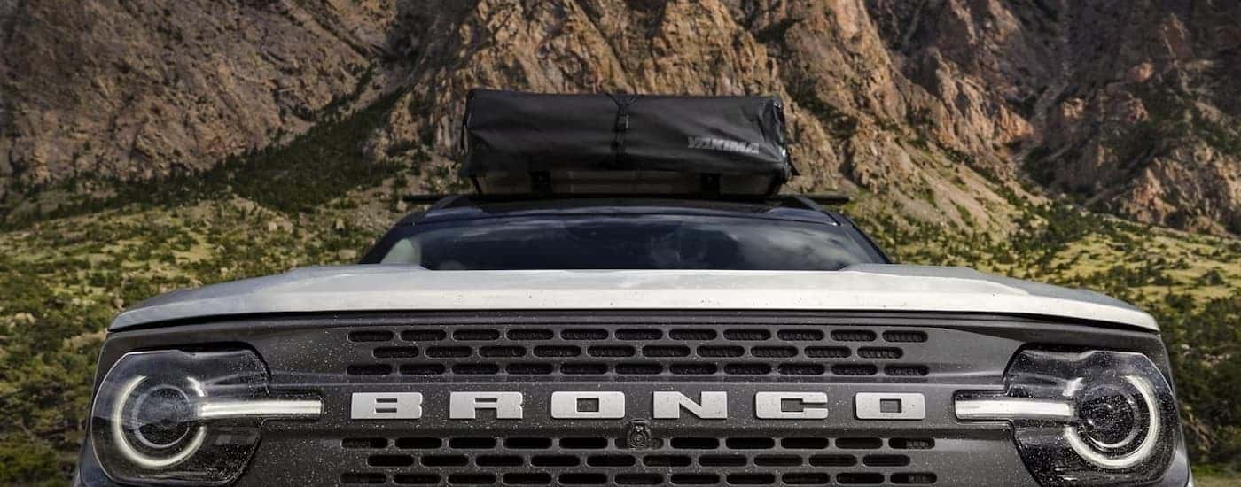 A close up of the grille on a white 2023 Ford Bronco Sport is shown.